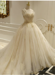 Champagne Ball Gown Tulle Spaghetti Straps Backless Wedding Dress