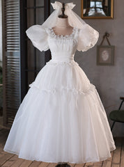 Robe de mariée à manches bouffantes en tulle blanc